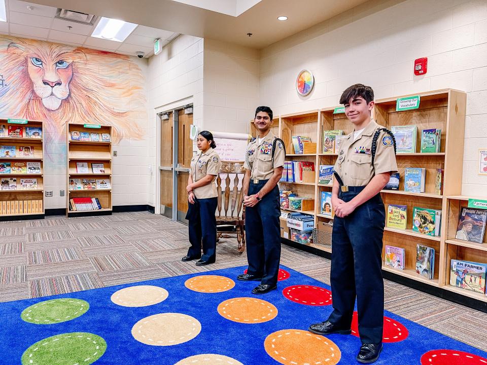 Central High School JROTC members, from left, 11th grader Vilma Castaneda, freshman Brodie Trave Hackworth and senior Deep Mistry, answer questions about JROTC and high school life at a fifth grade boy’s leadership group at Inskip Elementary School, March 30, 2022.