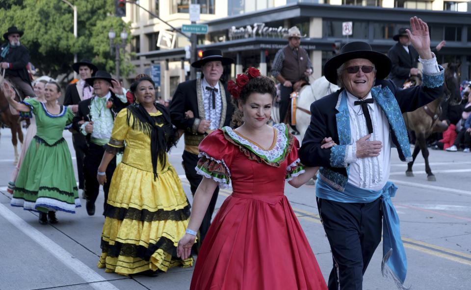 The cast of "Ramona," California's official state outdoor play, walks along on Colorado Boulevard during the 134th Rose Parade in Pasadena, Calif., Monday, Jan. 2, 2023. (Dean Musgrove/The Orange County Register via AP)