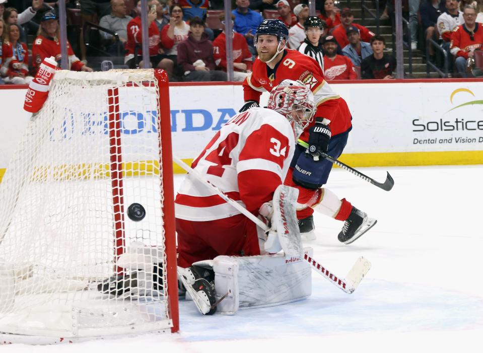 Sam Bennett of the Florida Panthers misses the net in overtime against Alex Lyon of the Detroit Red Wings at Amerant Bank Arena on March 30, 2024 in Sunrise, Florida. The Panthers defeated the Red Wings 3-2 in the shootout.