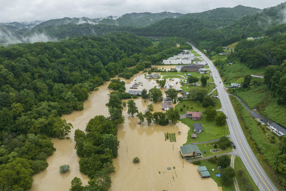 FILE - Homes and structures are flooded near Quicksand, Ky., Thursday, July 28, 2022. The same stubborn weather system caused intense downpours in St. Louis and Appalachia that led to devastating and in some cases deadly flooding. (Ryan C. Hermens/Lexington Herald-Leader via AP, File)