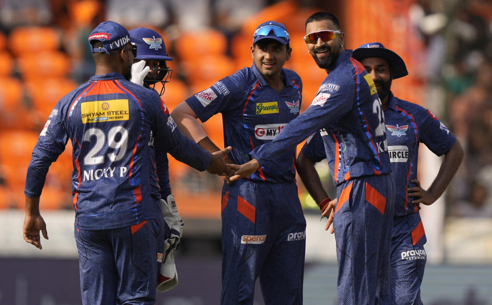 Lucknow Super Giants bowler Krunal Pandya, second from left, celebrates the wicket of Sunrisers Hyderabad's Aiden Markram with his teammates during the Indian Premier League cricket match between Sunrisers Hyderabad and Lucknow Super Giants in Hyderabad, Saturday, May 13, 2023. (AP Photo/Mahesh Kumar A.)