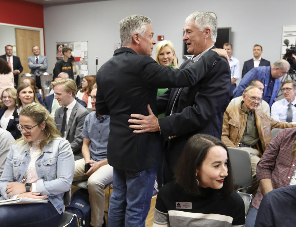 Jon Huntsman Jr., left, embraces long time friend Don Olsen prior to speaking during a forum at the Michael O. Leavitt Center for Politics and Public Service at Southern Utah University in Cedar City, Utah, Thursday, Nov. 14, 2019. Huntsman, a former Utah governor, one-time presidential candidate and ambassador to China and Russia, announced Thursday he will run for Utah governor again in 2020. (Steve Griffin/The Deseret News via AP)