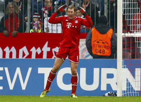 Bayern Munich's goalkeeper Manuel Neuer reacts during their Champions League Group D soccer match against Manchester City in Munich December 10, 2013. REUTERS/Michael Dalder