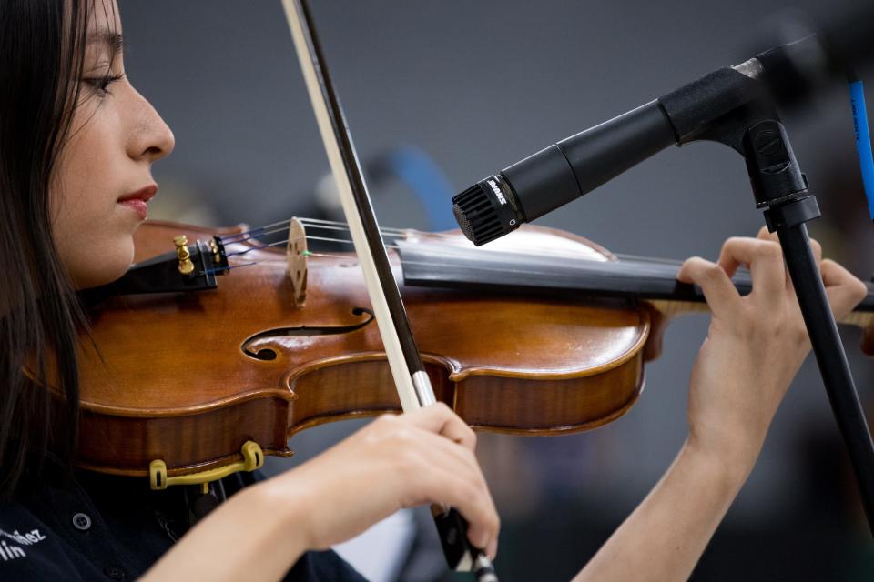 Rubi Sandoval-Montañez, a student at Franklin High School, plays the violin at rehearsal on Thursday, Feb.15, 2024. Mariachi Estrella Del Oeste is one of the four El Paso Independent School District high schools that have secured spots in the 2024 UIL State Mariachi Festival.