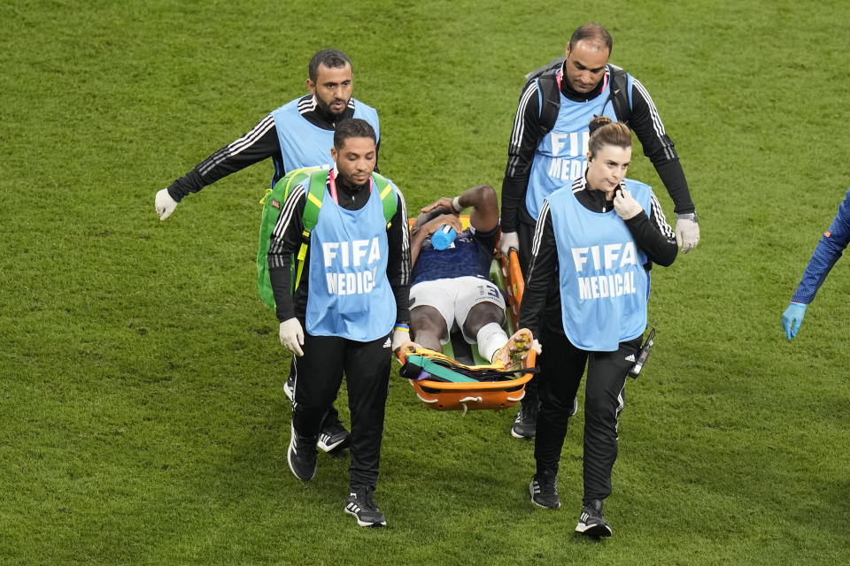 Ecuador's Enner Valencia is taken away with stretcher during the World Cup group A soccer match between the Netherlands and Ecuador, at the Khalifa International Stadium in Doha, Qatar, Friday, Nov. 25, 2022. (AP Photo/Aijaz Rahi)