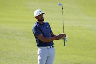 Tony Finau watches his approach shot from the first fairway during the final round of The American Express golf tournament on the Pete Dye Stadium Course at PGA West, Sunday, Jan. 24, 2021, in La Quinta, Calif. (AP Photo/Marcio Jose Sanchez)