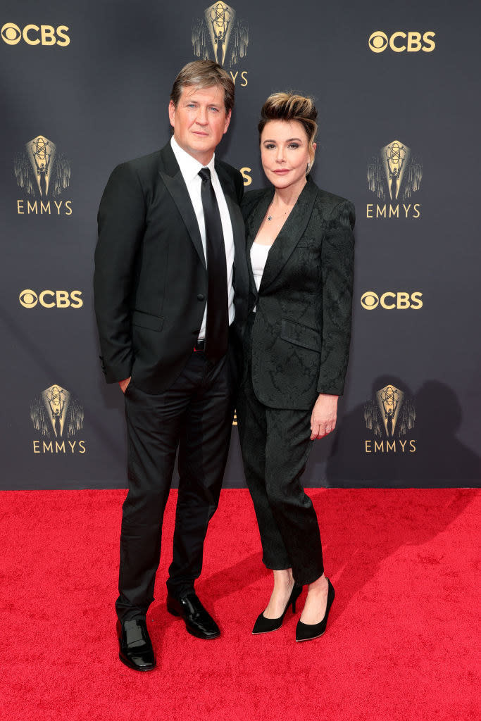 Bill Lawrence and Christa Miller wear dark suits