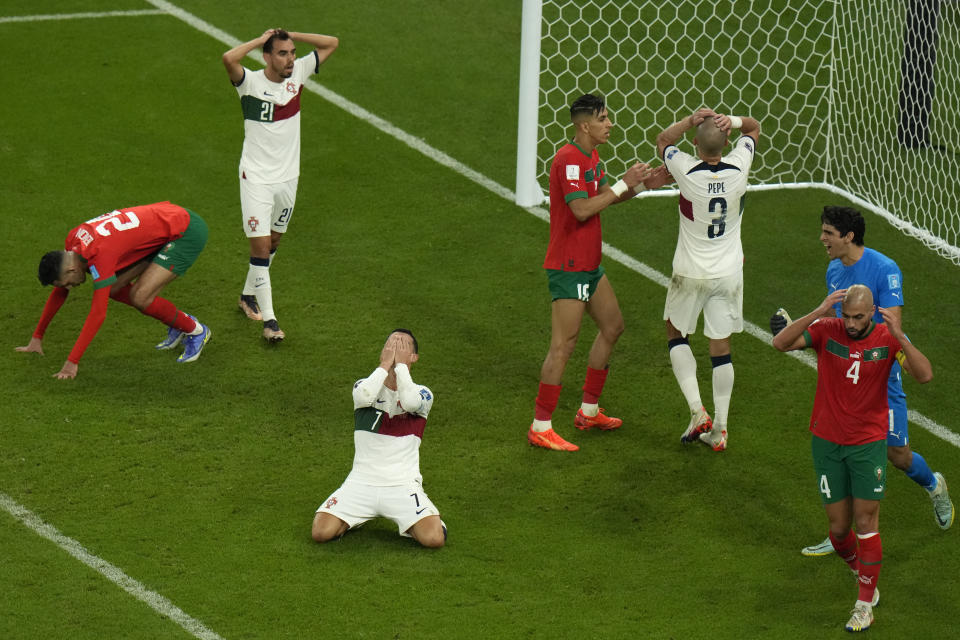 Portugal's Cristiano Ronaldo reacts after teammate Pepe missed a chance to score during the World Cup quarterfinal soccer match between Morocco and Portugal, at Al Thumama Stadium in Doha, Qatar, Saturday, Dec. 10, 2022. (AP Photo/Alessandra Tarantino)