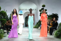<p>Colourful gowns ruled the runway, with model Adut Akech sporting a striking mint green number. Photo: Getty Images </p>