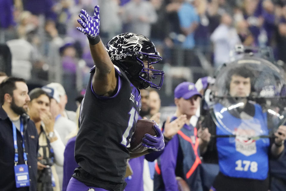 TCU wide receiver Quentin Johnston (1) celebrates a catch for a first down in the second half of the Big 12 Conference championship NCAA college football game against Kansas State, Saturday, Dec. 3, 2022, in Arlington, Texas. (AP Photo/LM Otero)