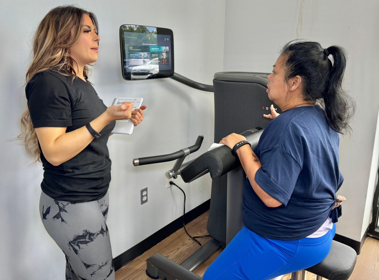A woman tests out the new EGYM technology at the Richmond Hill YMCA.