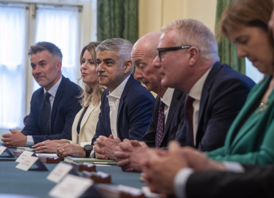 London Mayor Sadiq Khan Mayor of London, third left, sits next to Chancellor of the Duchy of Lancaster Pat McFadden and Mayor of the West Midlands Richard Parker as Britain's Prime Minister Keir Starmer hosts the first roundtable with regional UK mayors, at Downing Street, in London, Tuesday, July 9, 2024. (Ian Vogler, Pool Photo via AP)