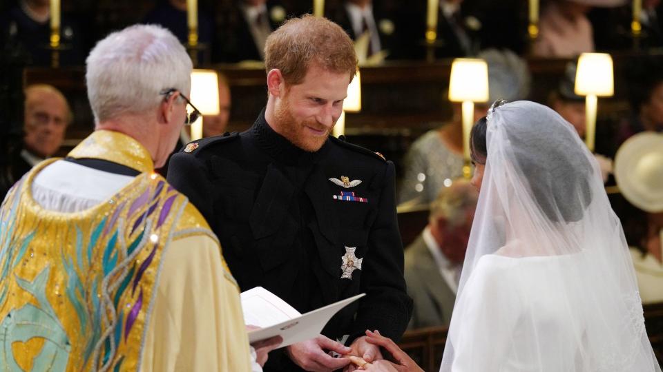 Prince Harry and Meghan Markle exchanging rings