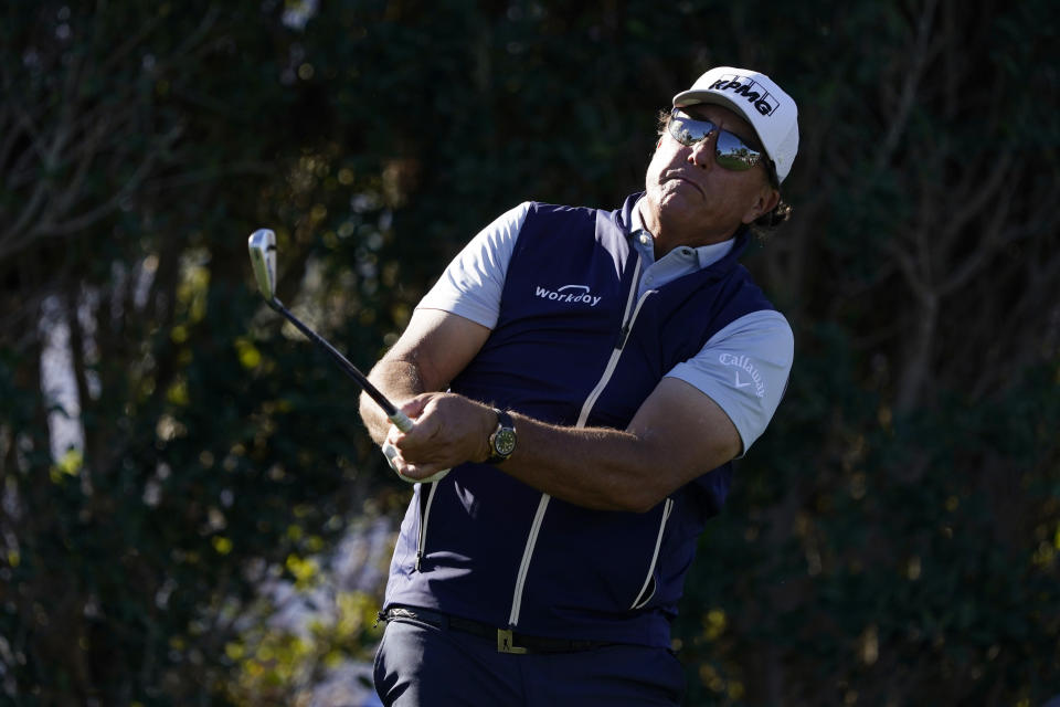Phil Mickelson hits from the third tee during the first round of the American Express golf tournament at La Quinta Country Club Thursday, Jan. 20, 2022, in La Quinta, Calif. (AP Photo/Marcio Jose Sanchez)
