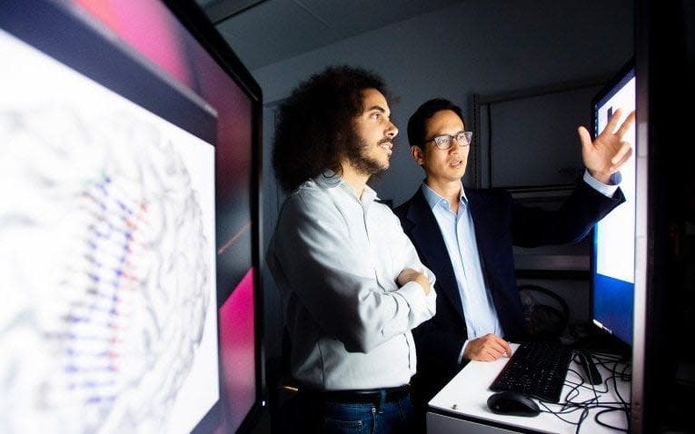 Scientists at UCSF have decoded brain speech signals into written text. Eddie Chang (right), MD, and David Moses, PhD, in Chang’s laboratory at UCSF.  - Noah Berger/Noah Berger