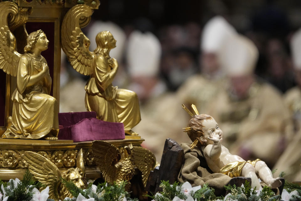 A statue of Baby Jesus lies after being unveiled as Pope Francis presides over Christmas eve Mass, at St. Peter's Basilica at the Vatican, Sunday Dec. 24, 2023. (AP Photo/Gregorio Borgia)