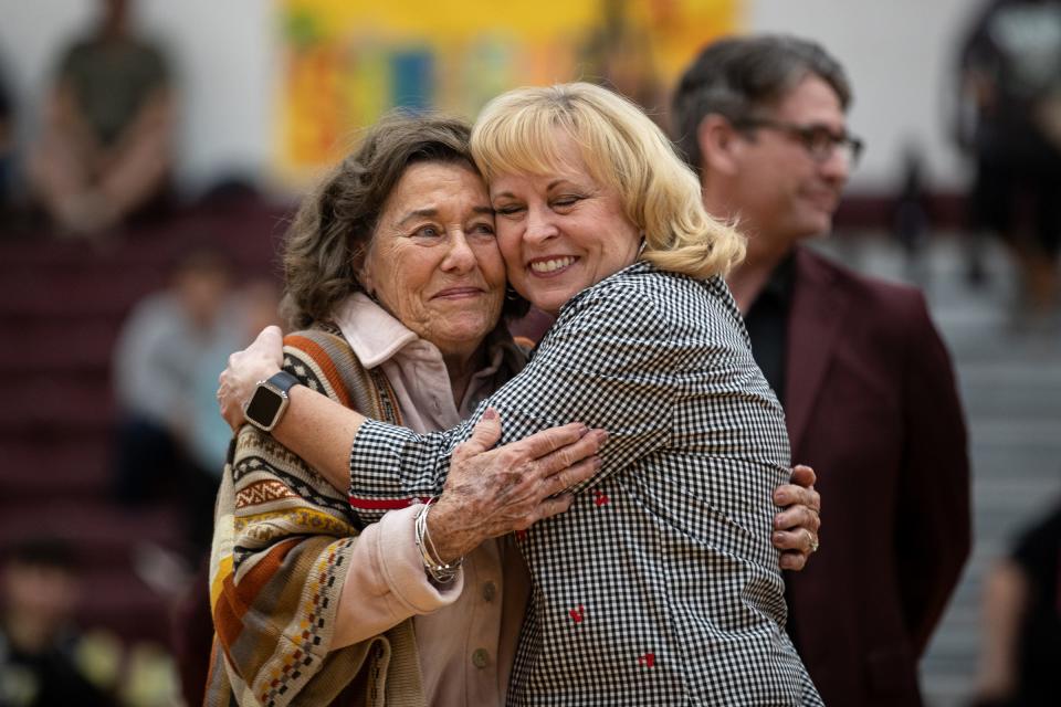 Former Calallen girls basketball coach Leta Andrews is hugged by 1982 player Deborah Haven during a gym dedication ceremony in Andrews' honor at Calallen High School on Friday, Jan. 13, 2023, in Corpus Christi, Texas.