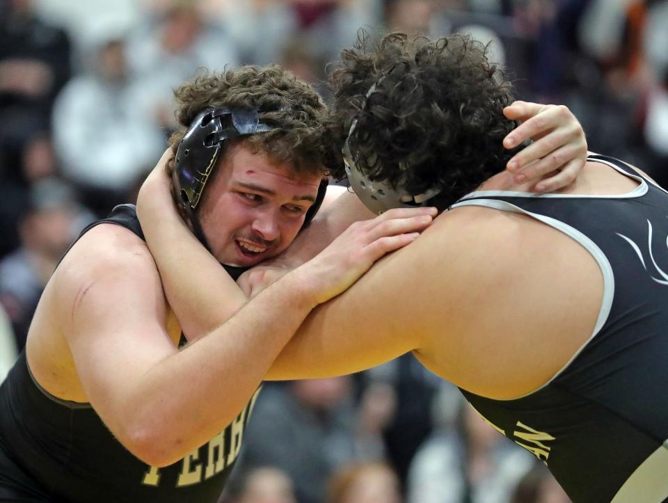 Aidan Fockler of Perry, left, wrestles Mark Effendian of Faith Christian Academy, Pa. during their 285-pound match for fifth place at the Ironman.