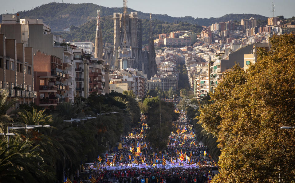 Catalan pro-independence protesters gather during a demonstration in Barcelona, Spain, Saturday, Oct. 26, 2019. Protests turned violent last week after Spain's Supreme Court convicted 12 separatist leaders of illegally promoting the wealthy Catalonia region's independence and sentenced nine of them to prison. (AP Photo/Emilio Morenatti)