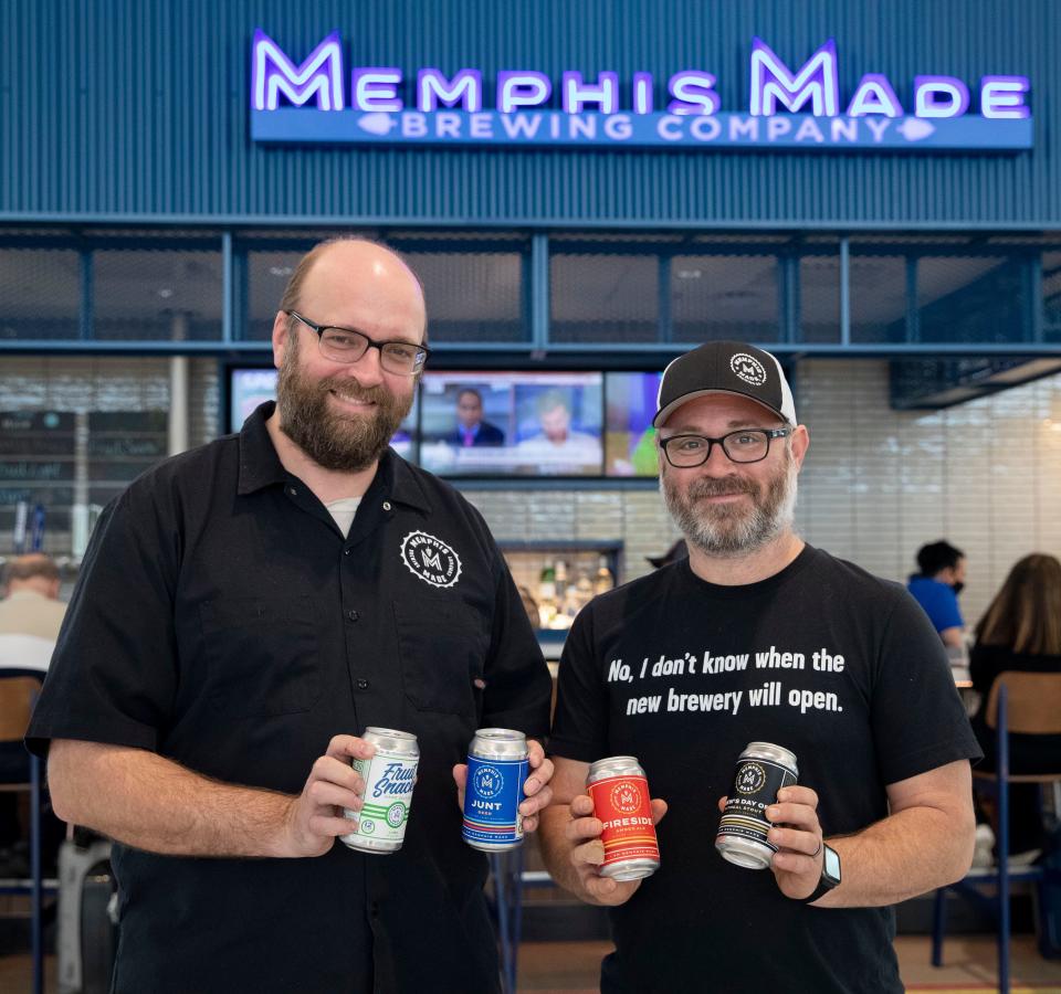 Co-founders Andy Ashby, left, and Drew Barton, right, pose in front of Memphis Made Brewing Company in Concourse B on Wednesday, March 2, 2022, at Memphis International Airport.