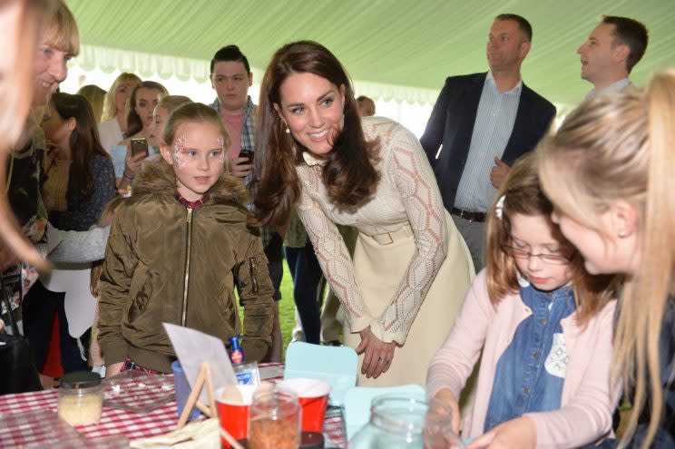 <i>The royals met with children in the grounds of Buckingham Palace [Photo: PA]</i>