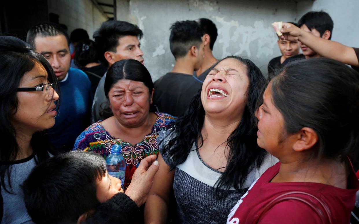 Guatemalan migrant Maria del Carmen Tambriz in tears after being returned from the US without her daughter - REUTERS