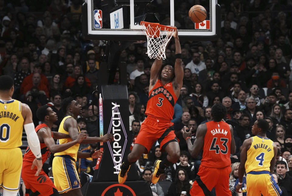 Toronto Raptors forward O.G. Anunoby hangs from the rim as he watches his shot bounce off the rim during first half of an NBA basketball game against the Los Angeles Lakers in Toronto on Wednesday, Dec. 7, 2022. (Chris Young/The Canadian Press via AP)