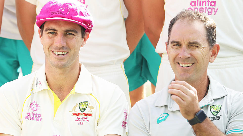 Pat Cummins and Justin Langer sit side by side for a photo opportunity.