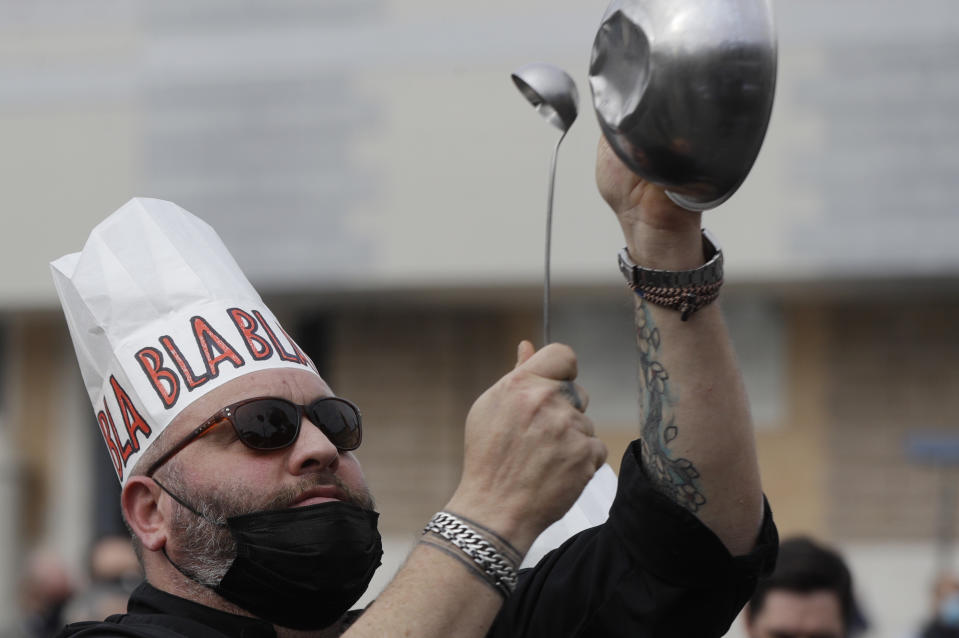 Restaurants and pub owners protest against restrictive measures implemented to curb the spread of COVID-19 pandemic, in Rome Monday, Nov. 2, 2020. Italian Premier Giuseppe Conte is expected to announce even stricter measures to the Parliament later today. (AP Photo/Gregorio Borgia)