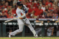 St. Louis Cardinals' Andrew Knizner hits a two-RBI ground rule double during the sixth inning of a baseball game against the Cincinnati Reds in Cincinnati, Friday, July 23, 2021. (AP Photo/Aaron Doster)