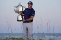 Phil Mickelson holds the Wanamaker Trophy after winning the PGA Championship golf tournament on the Ocean Course, Sunday, May 23, 2021, in Kiawah Island, S.C. (AP Photo/David J. Phillip)