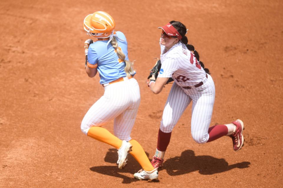 Tennessee outfielder Katie Taylor (1) is tagged out on her way to second base by Alabama infielder Kali Heivilin (22) during an NCAA super regional game between Tennessee and Alabama at Sherri Parker Lee Stadium in Knoxville, TN, Saturday, May 25, 2024.