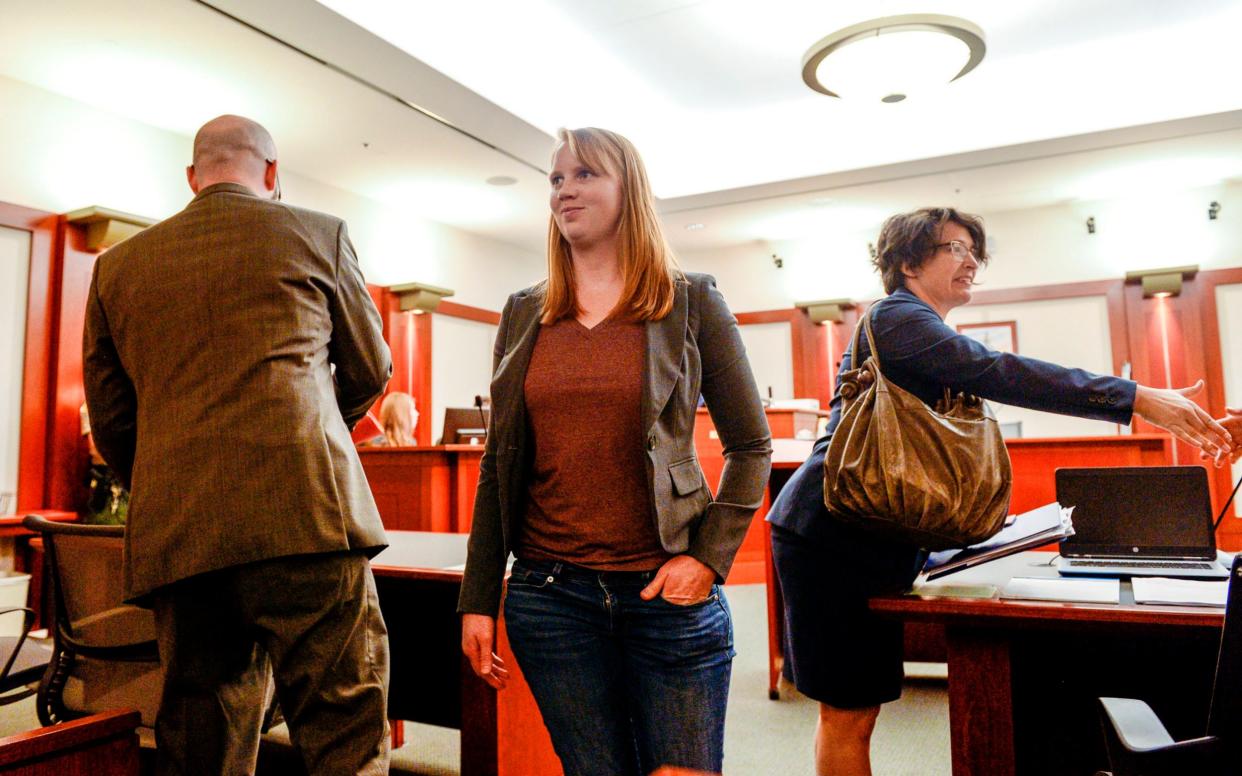 Tilli Buchanan smiles as she leaves court - The Salt Lake Tribune