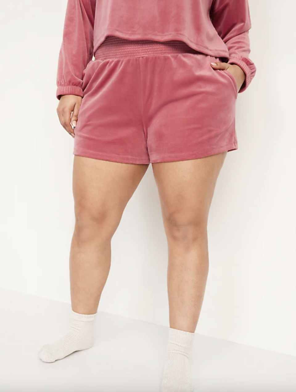 plus size model in pink High-Waisted Velvet Boxer Shorts (Photo via Old Navy)