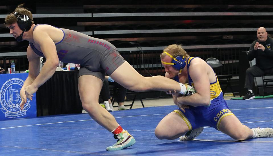 Canton's Tanner Meyers (right) holds on to Parker's Charlie Patten during their Class B 195-pound semifinal match in the South Dakota High School Wrestling Championships on Friday, Feb. 24, 2023 at The Monument in Rapid City. Meyers repeated as a state champion and helped Canton secured its sixth-straight State B title.