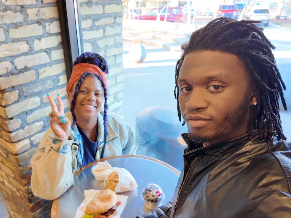 sojourner and her brother sitting inside a kopps in Wisconsin