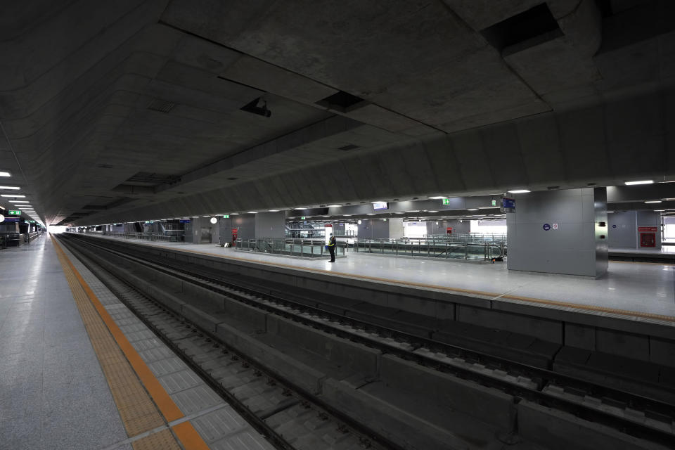 A security guard stands on the platform at the Krung Thep Aphiwat Central Terminal in Bangkok, Thailand, Thursday, Jan. 19, 2023. Thailand ushered in a new age of train travel on Thursday when what’s said to be Southeast Asia’s biggest railway station officially began operations. (AP Photo/Sakchai Lalit)