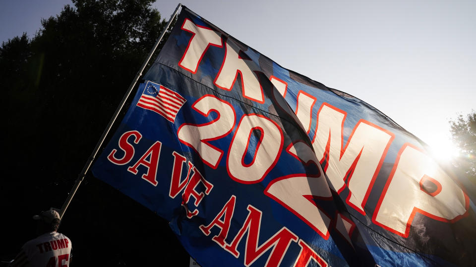 Former President Donald Trump's supporters gather outside of the Fulton County Jail, Thursday, Aug. 24, 2023, in Atlanta. (AP Photo/Brynn Anderson)