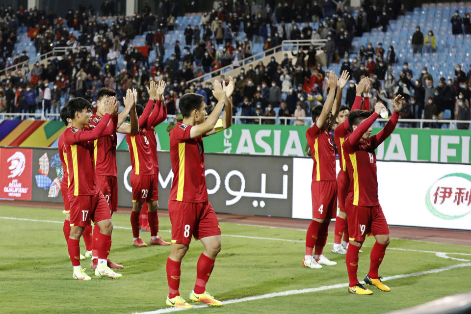 The Vietnam national football team acknowledging their supporters after beating China in their World Cup Asian Qualifier final-round match.