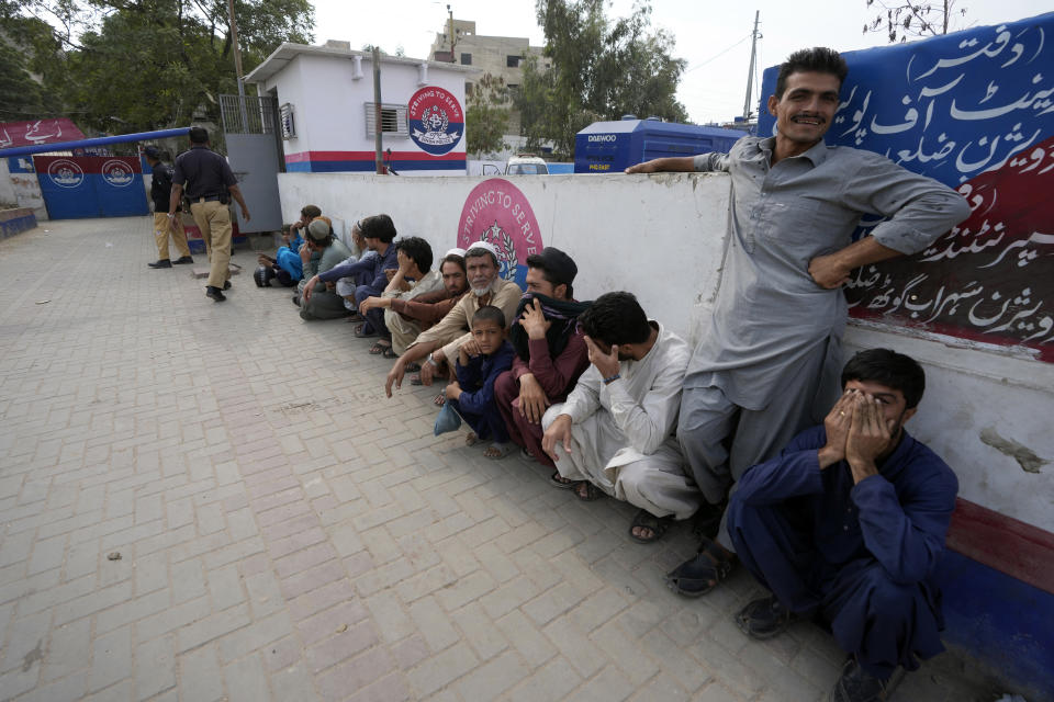 Immigrants, mostly Afghans, line up as they wait for their turn to verify data at a counter of Pakistan's National Database and Registration Authority in Karachi, Pakistan, Friday, Nov. 17, 2023. The U.N. health agency is warning that about 1.3 million Afghans are expected to return to Afghanistan from Pakistan where authorities earlier are expelling foreigners, mostly Afghans, living in the country illegally. It had forced at least 340,000 Afghans to leave Pakistan after spending decades, officials said Friday. (AP Photo/Fareed Khan)