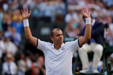 Tennis - Wimbledon - London, Britain - July 10, 2017 Luxembourg’s Gilles Muller celebrates winning the fourth round match against Spain’s Rafael Nadal REUTERS/Matthew Childs