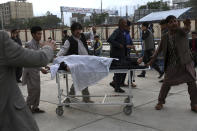 An injured school student is transported to a hospital after a bomb explosion near a school in west of Kabul, Afghanistan, Saturday, May 8, 2021. A bomb exploded near a school in west Kabul on Saturday, killing several people, many them young students, an Afghan government spokesmen said. (AP Photo/Rahmat Gul)