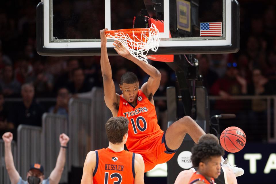 Auburn forward Jabari Smith (10) dunks during the second half of an NCAA college basketball game against Nebraska, Saturday, Dec. 11 , 2021, in Atlanta.