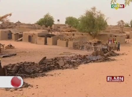 A pile of rubble is seen in the village of Sobame Da