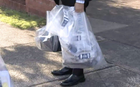 Australian Federal Police agents collecting evidence in relation to Chan Han Choi's case - Credit: Australian Federal Police