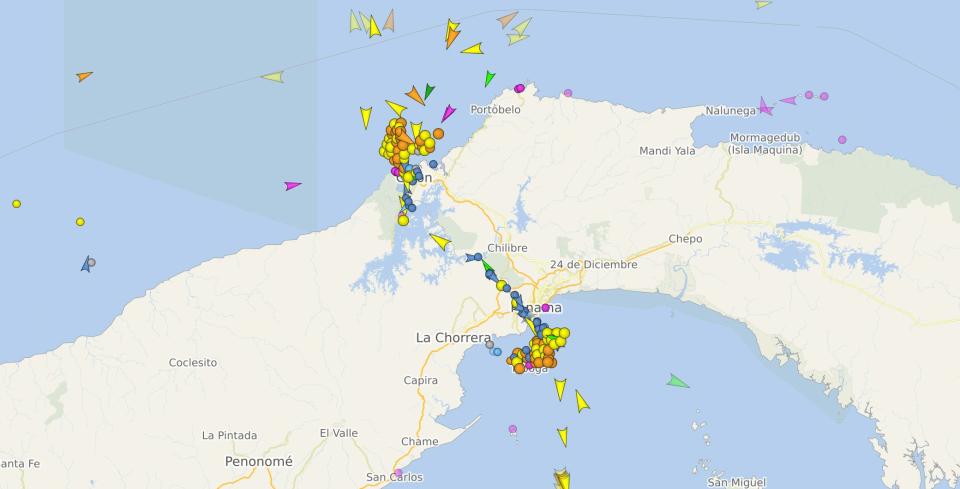 A screenshot from ship-tracking website vesselfinder.com showing numerous ships, represented by dots and arrows, clustered either side of the Panama Canal on a map, as of November 9, 2023.