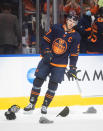 Edmonton Oilers' Connor McDavid (97) celebrates his hat trick against the Calgary Flames, during the third period of an NHL hockey game Saturday, Oct. 16, 2021, in Edmonton, Alberta. (Jason Franson/The Canadian Press via AP)