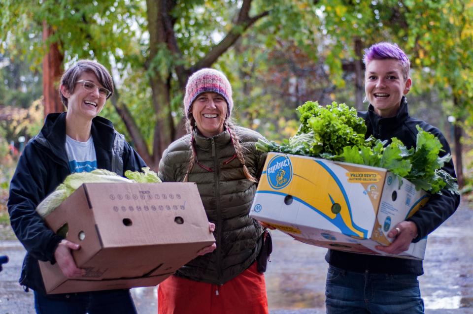A group of volunteers from Friendship Donation Network pick up food from the Ithaca Farmers Market which they helped to distribute to Tompkins County food pantries.