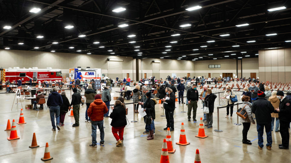 People at a vaccination site in Arlington, Texas, in February wait to be inoculated against COVID-19.