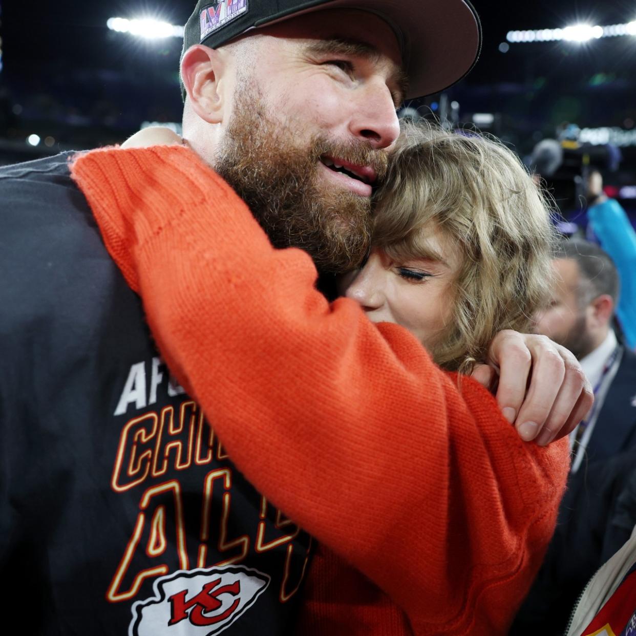  Taylor Swift and Travis Kelce on field after the Chiefs victory on January 28, 2024. 